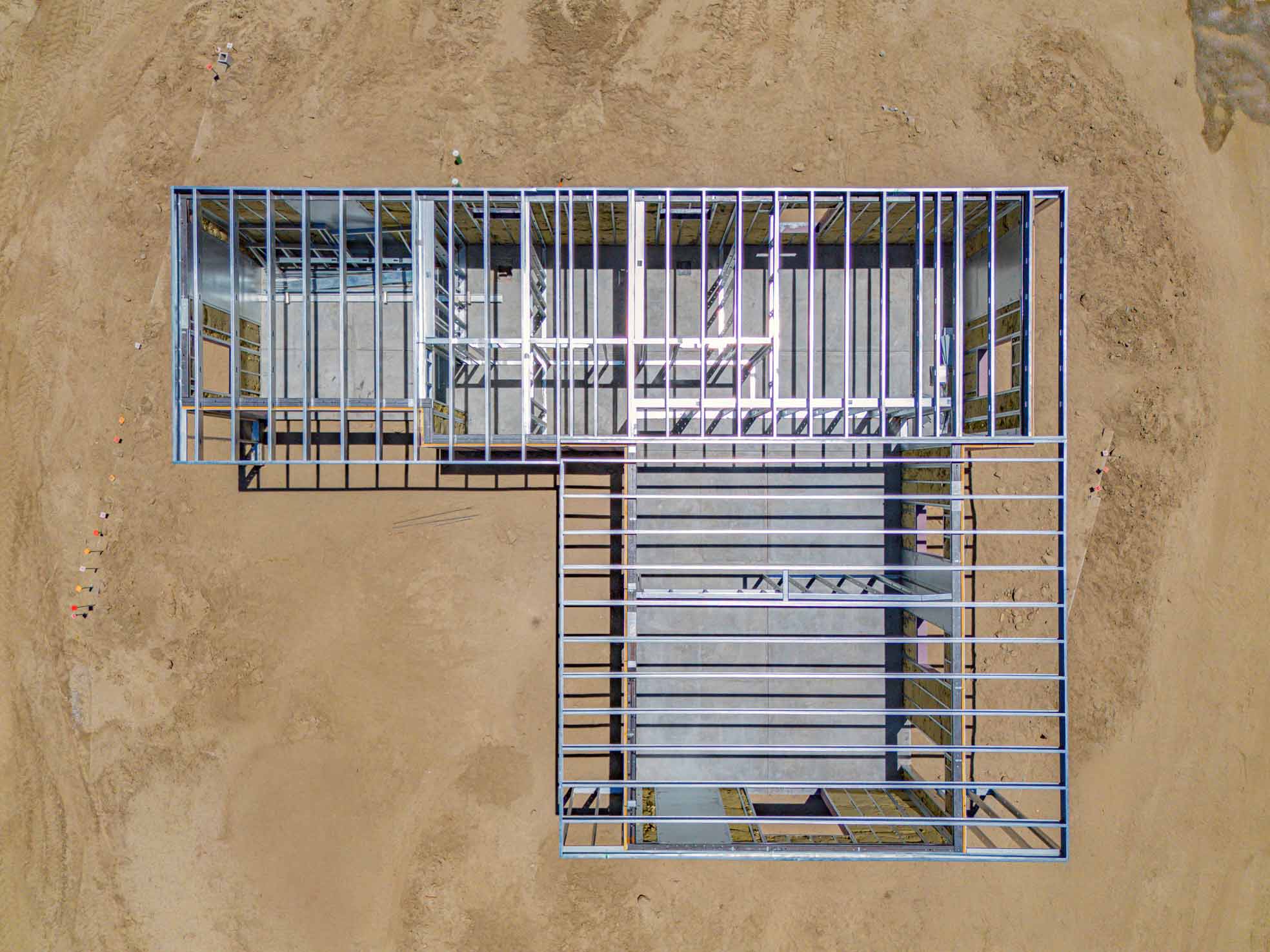 Aerial view of the Borrego Springs structure mid-assembly, showing steel roof framing